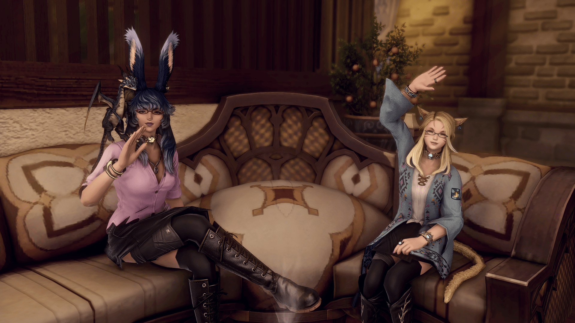 Us Sisters waving while sitting on a couch in Final Fantasy XIV.