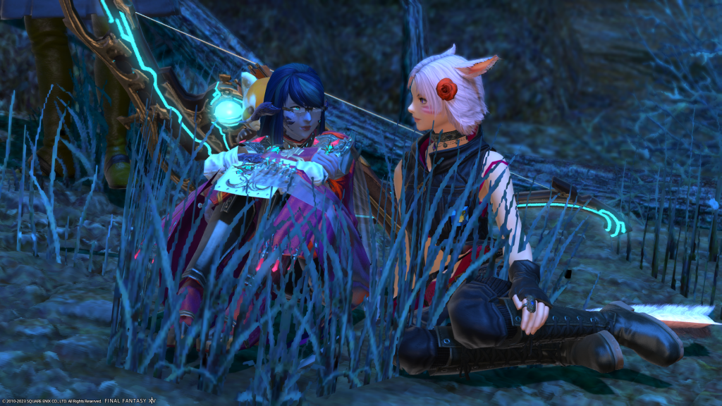 My assistant with Sirena sitting down in a blue grassy area