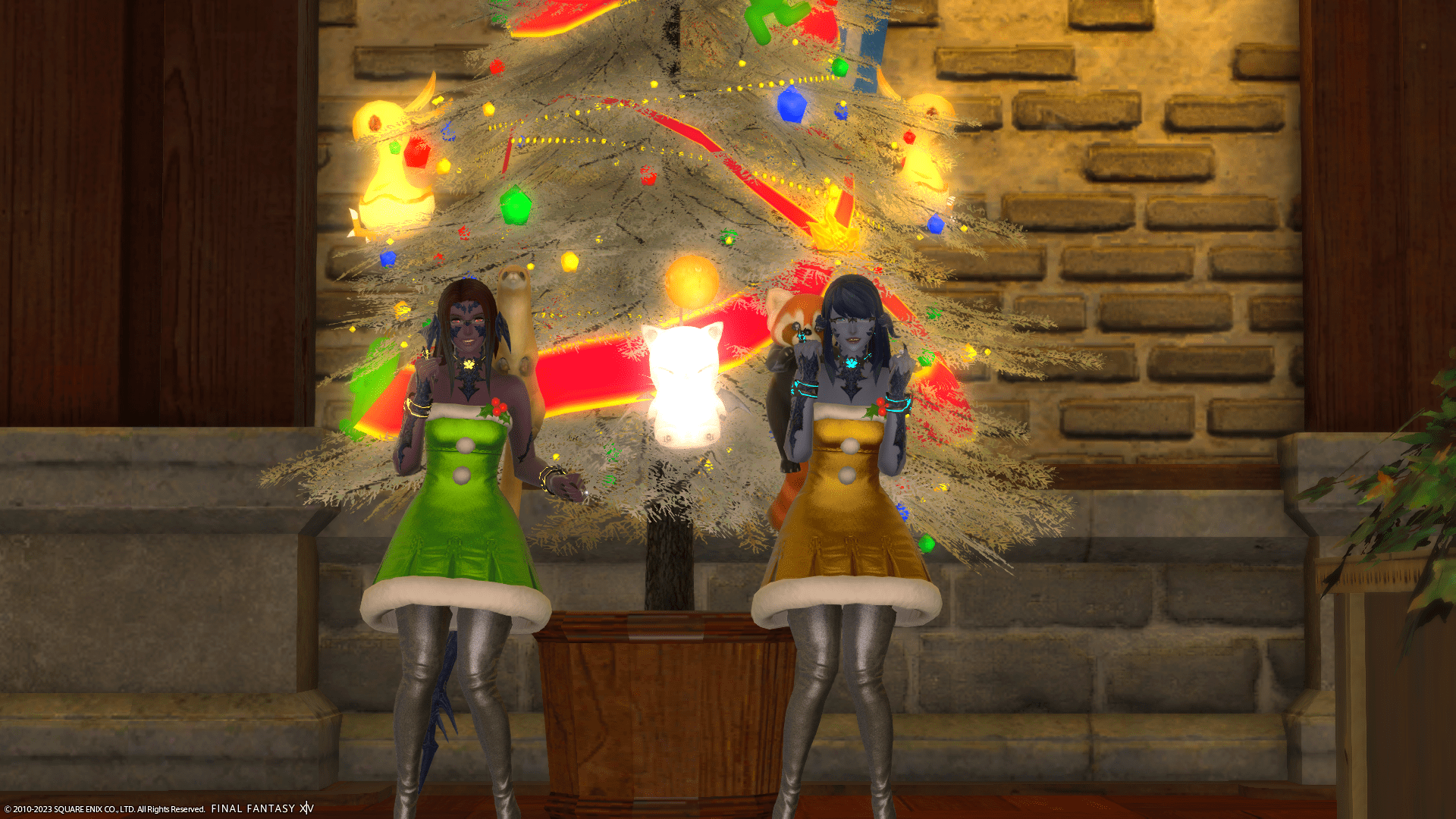 The Dragon Cousins in Winter Holiday dresses cheering happily in front of a silver decorated tree in Final Fantasy XIV.
