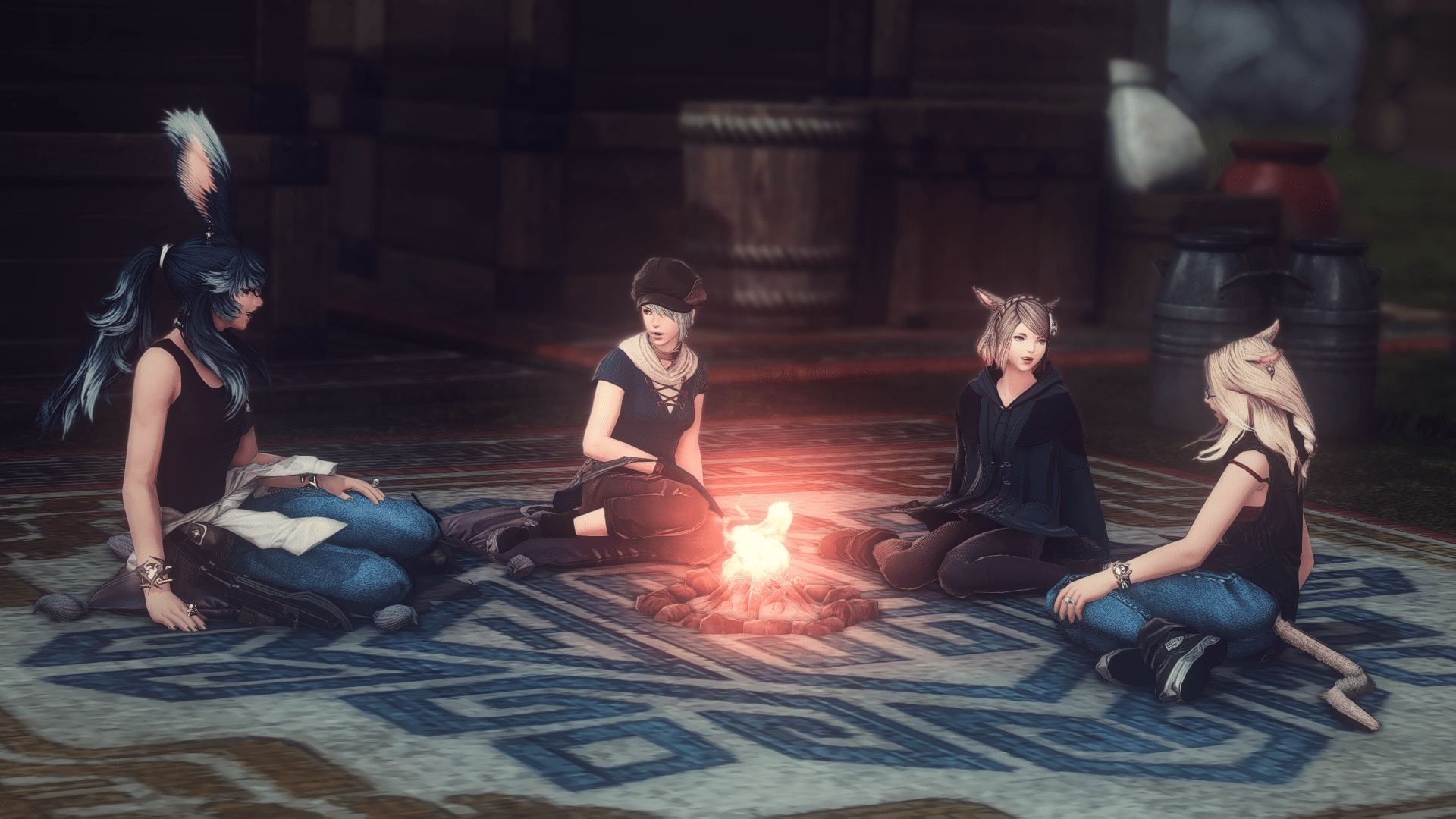 Aikirees, Azelma, Akari, and I around a campfire at night having a lovely chat.