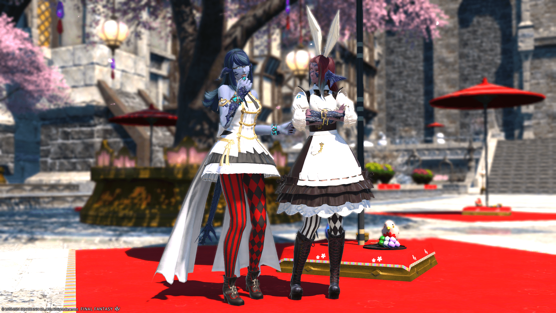 Laureine and Lizicus dressed up for the Little Ladies' Day & Hatching-Tide event. Standing in front of Little Ladies' Day decor.