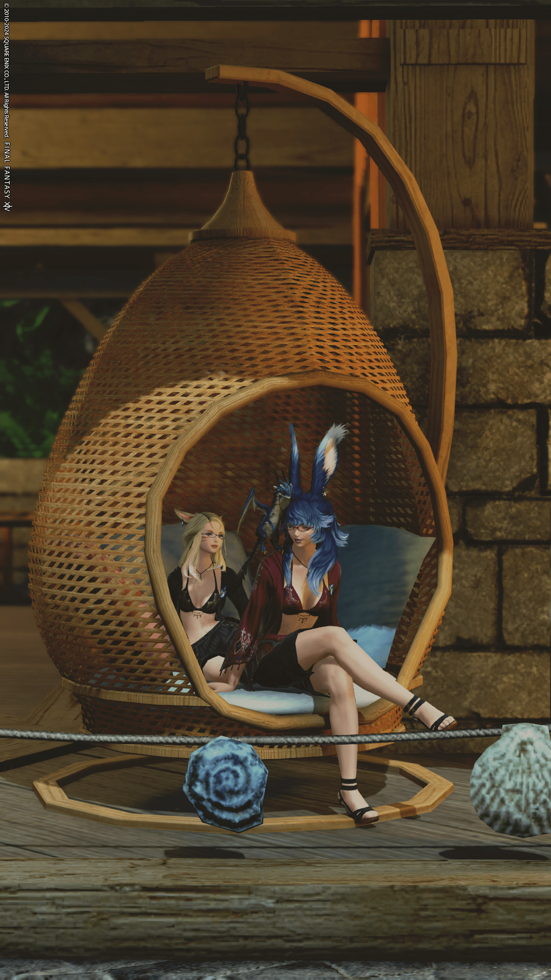 Aikirees and I sitting in a hanging basket chair within Island Sanctuary.