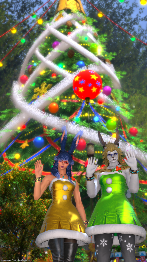 Aikirees and I waving in front of a Starlight Tree in our festive dresses.