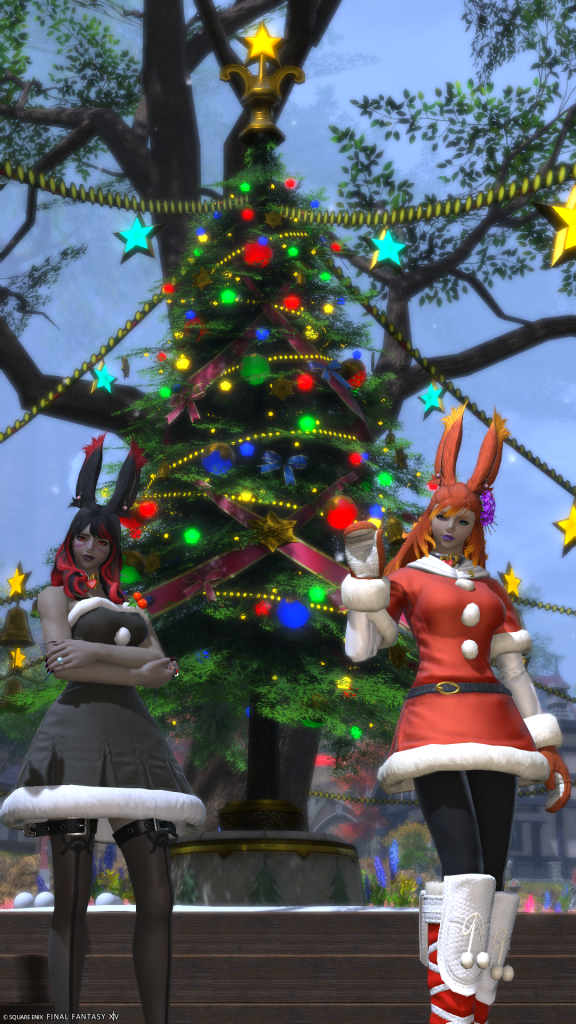 Elizara and Reinylla in font of a Starlight Tree in Starlight attire.