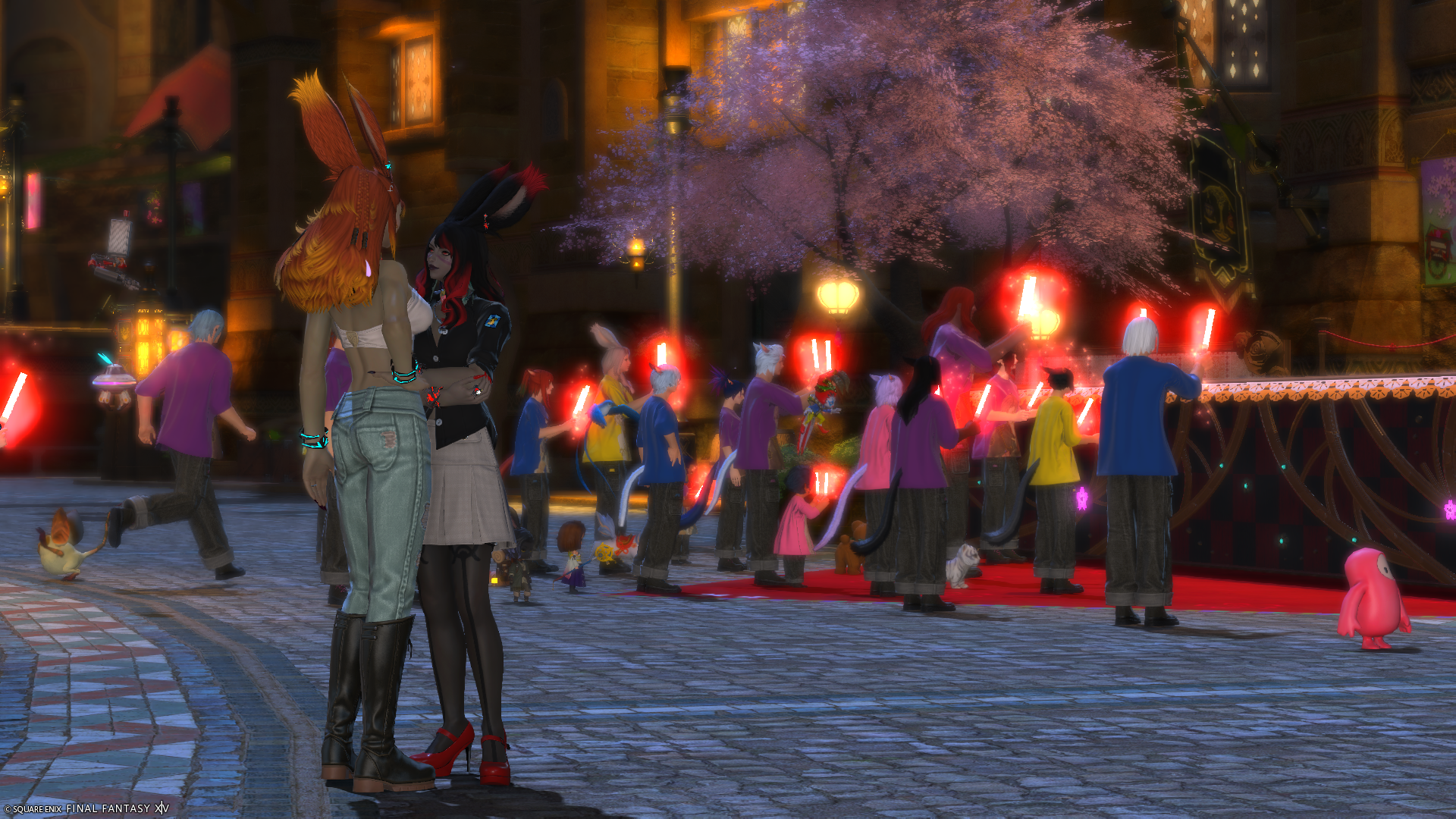 Reinylla and Elizara at Little Ladies' Day concert with patrons in the background.