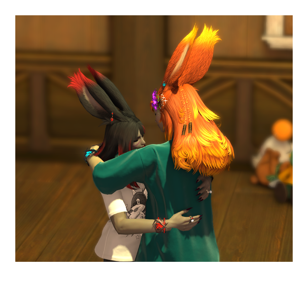 Polaroid photo of Reinylla and Elizara hugging inside their house.