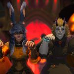 Aikirees and I in our All Saints' Wake outfits in front of a bunch of pumpkins and demonic gate gesturing menacingly.