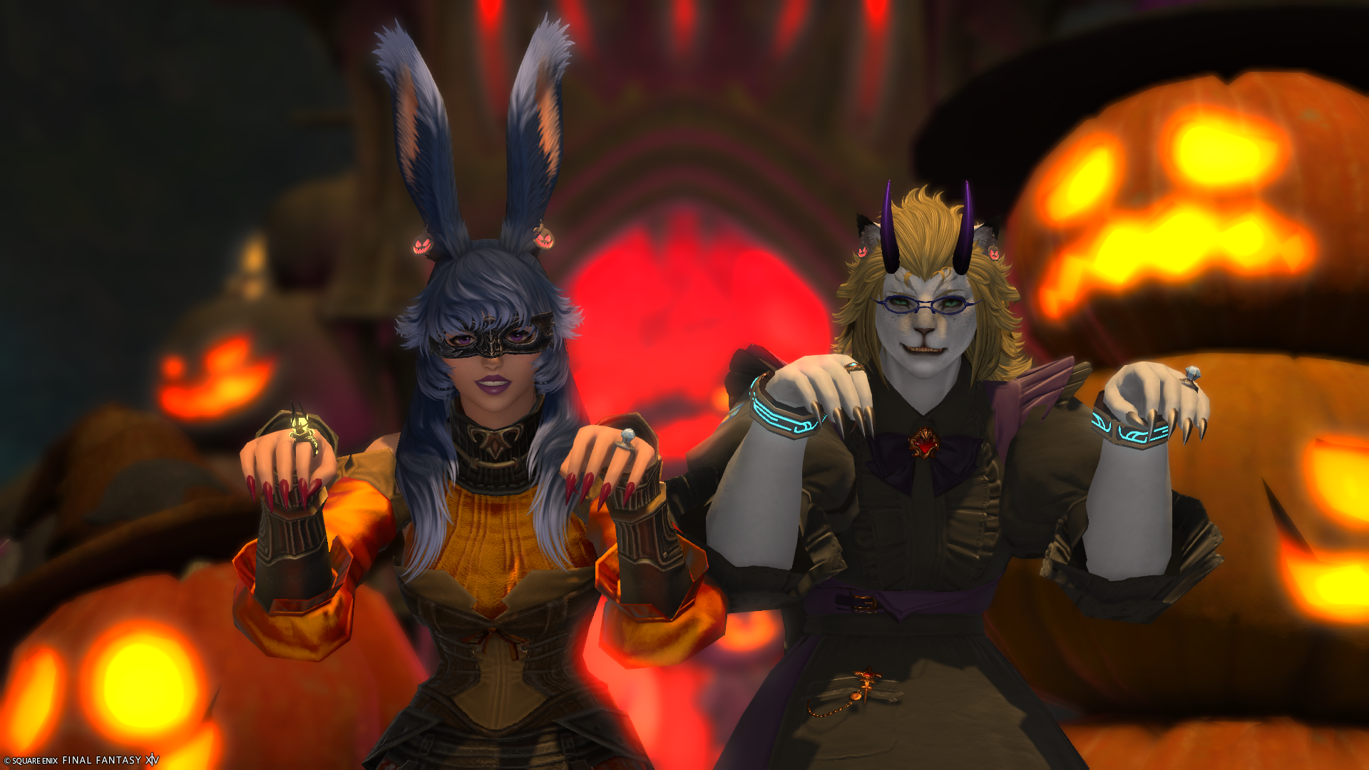 Aikirees and I in our All Saints' Wake outfits in front of a bunch of pumpkins and demonic gate gesturing menacingly.